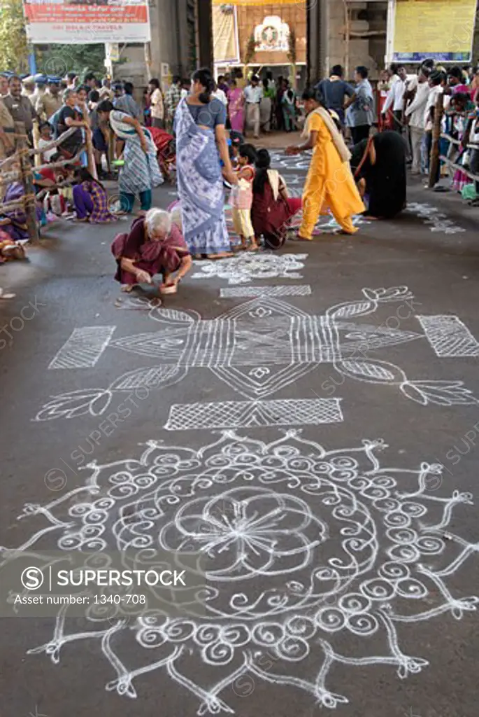 Women making kolam in front of a temple, Kapaleeshwarar Temple, Mylapore, Chennai, Tamil Nadu, India