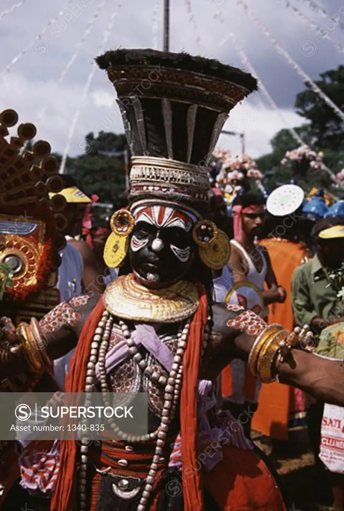 Man performing Theyyam dance, Kerala, India