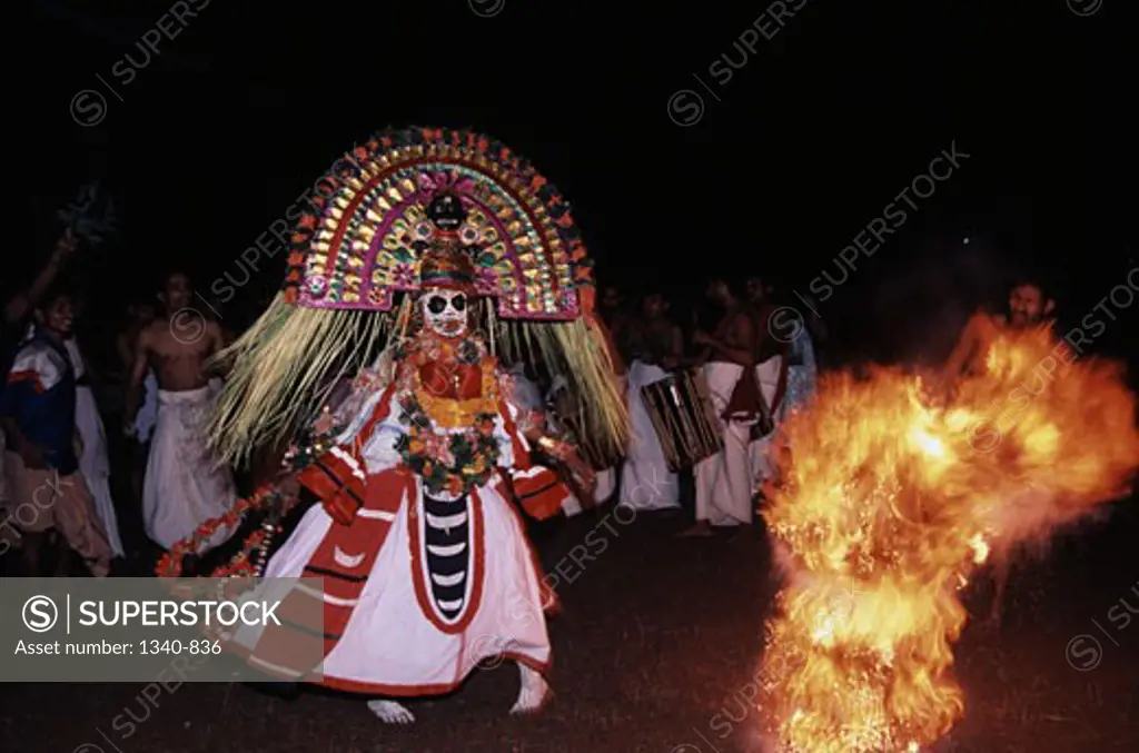 Man performing Mudiyettu the ritualistic dance in a temple, Bhadrakali Temple, Kerala, India