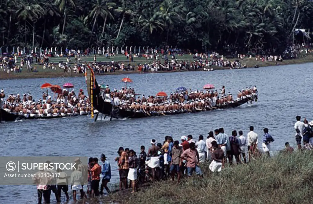 Group of people watching a traditional snake boat racing, Aranmula Boat Race, Pampa River, Aranmula, Kerala, India