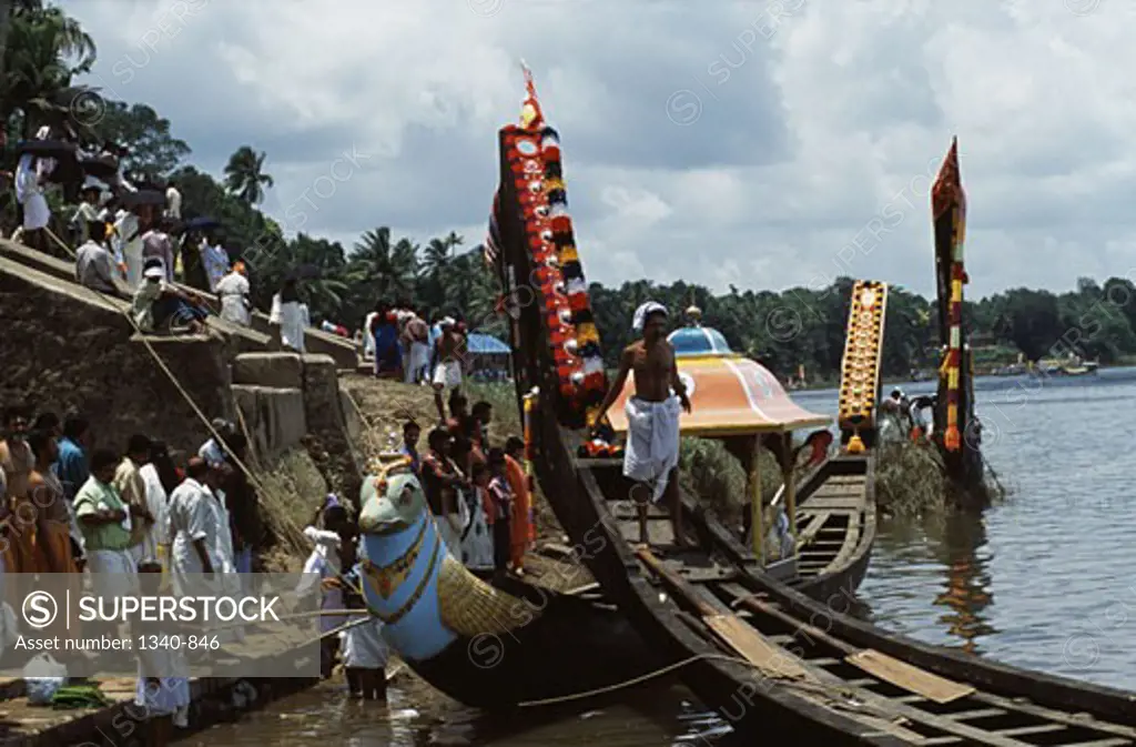 Group of people participating in a traditional snake boat racing, Aranmula Boat Race, Aranmula, Kerala, India