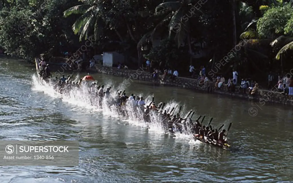 High angle view of a group of people participating in a traditional snake boat racing, Payippad Boat Race, Payippad Lake, Kerala, India