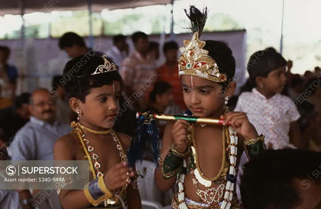 Boy and a girl in costumes in a religious festival of Krishna Janmashtami, Tamil Nadu, India