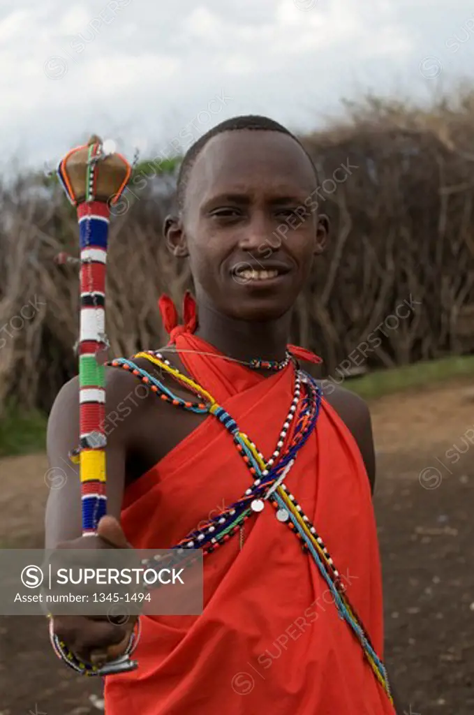 Close-up of a Masai young man standing, Masai Mara, Kenya
