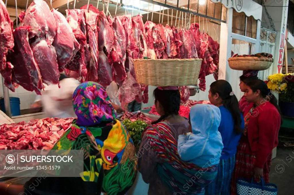 Customers at a butcher's shop, Totonicapan, Guatemala