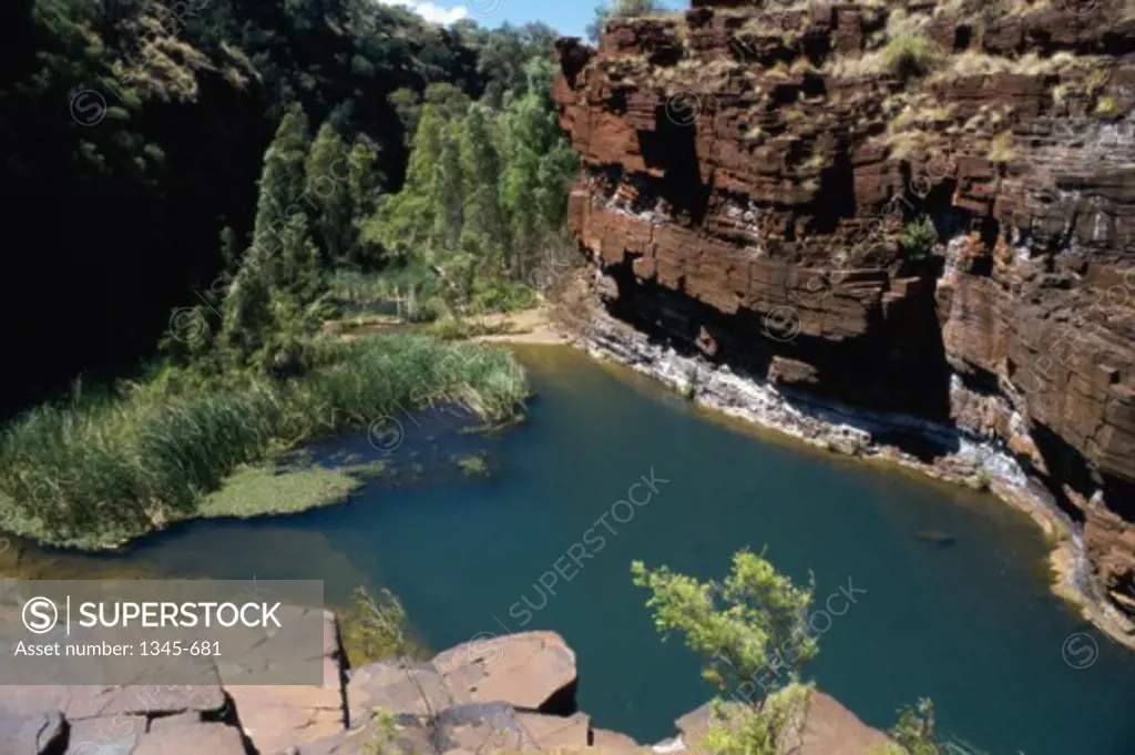 High angle view of a pond surrounded by mountains, Fortescue Falls, Karijini National Park, Western Australia, Australia