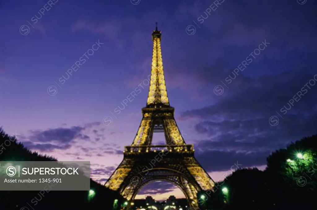 Low angle view of a tower lit up at night, Eiffel Tower, Paris, France