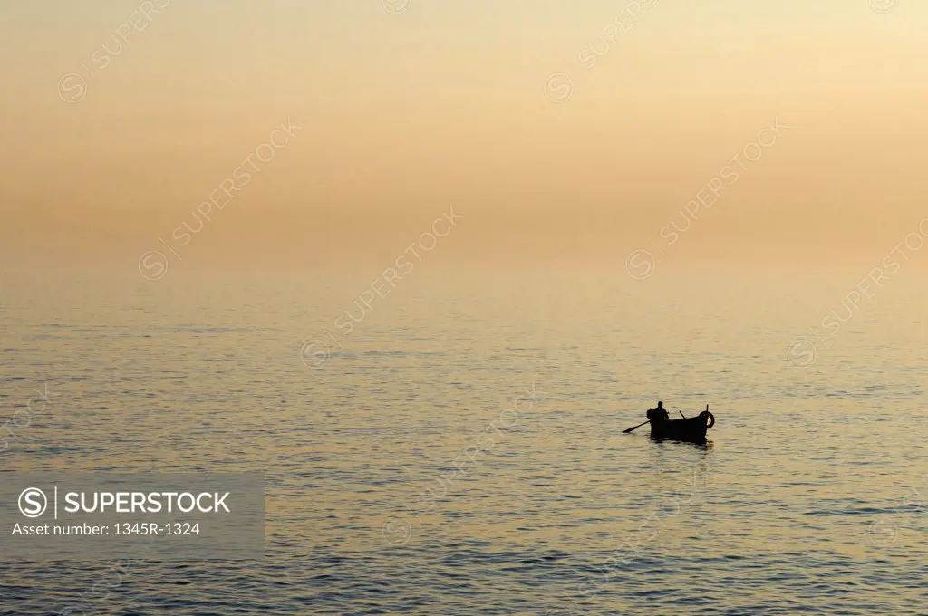 Silhouette of a boat in the sea, Camogli, Liguria, Italy