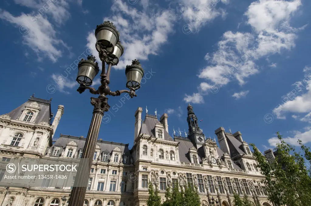 Low angle view of a lamppost in front of a city hall, Hotel De Ville, Paris, Ile-de-France, France