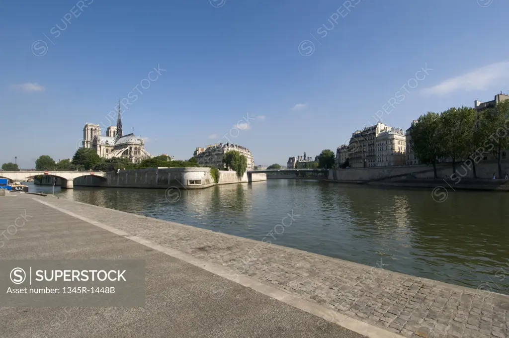 Cathedral at the waterfront, Notre Dame, Seine River, Paris, Ile-de-France, France