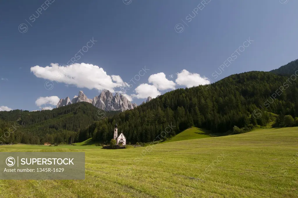 Church with mountain range in the background, St. Johann Church, Funes Valley, Dolomites, Trentino-Alto-Adige, Italy