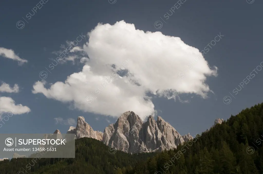 Clouds over mountain range, Geisler Gruppe, Funes Valley, Dolomites, Trentino-Alto-Adige, Italy