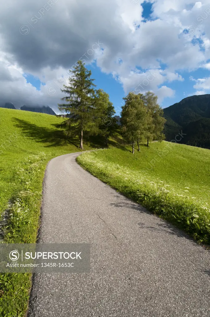 Road passing through a hill, Santa Maddalena, Funes Valley, Dolomites, Trentino-Alto-Adige, Italy