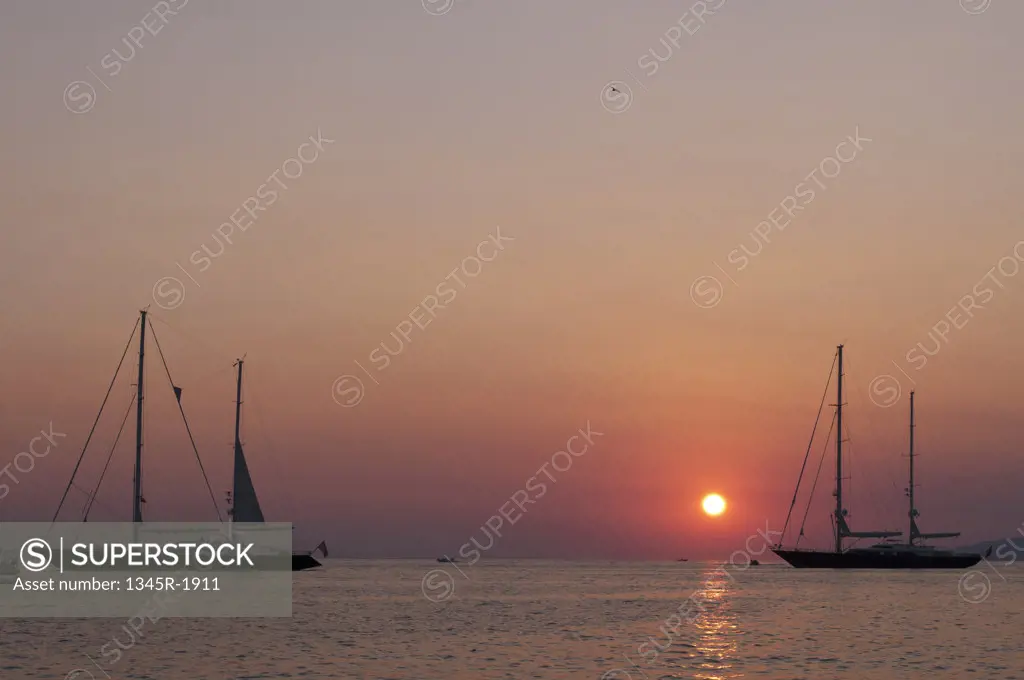 Silhouette of boats at sunset, Mykonos Town, Mykonos, Cyclades Islands, Greece