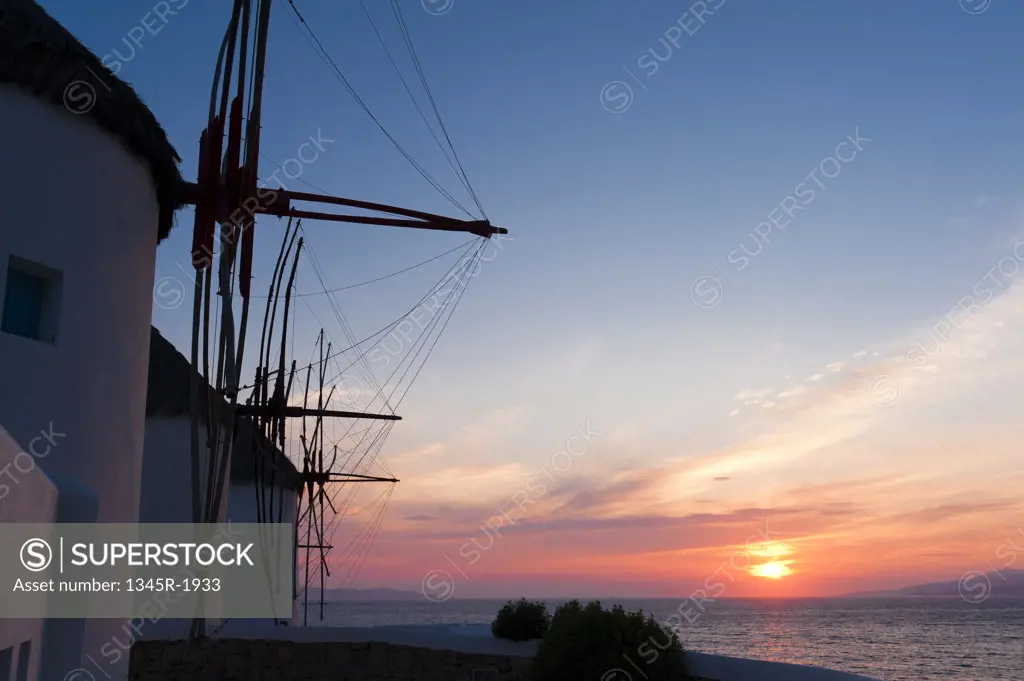 Traditional windmill at sunset, Mykonos Town, Mykonos, Cyclades Islands, Greece