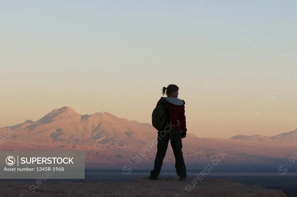 Chile, Atacama Desert, Tourist looking at landscape