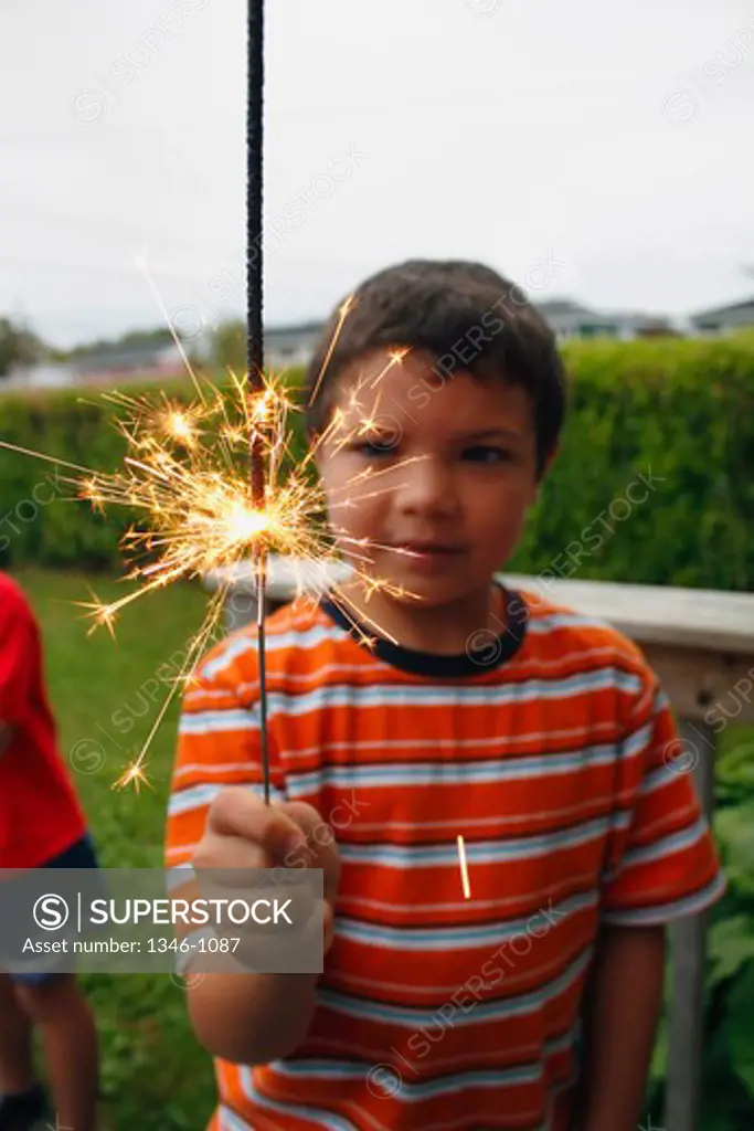 Boy holding a sparkler