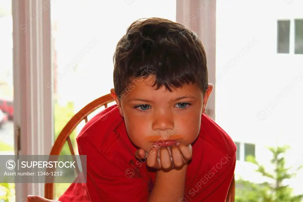 Close-up of a boy thinking