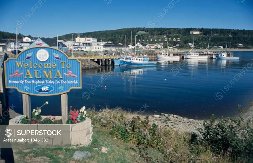 Welcome sign by a harbor, Alma, New Brunswick, Canada