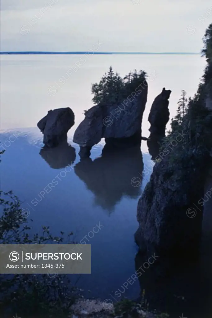 Reflection of rocks in water, Hopewell Rocks, New Brunswick, Canada