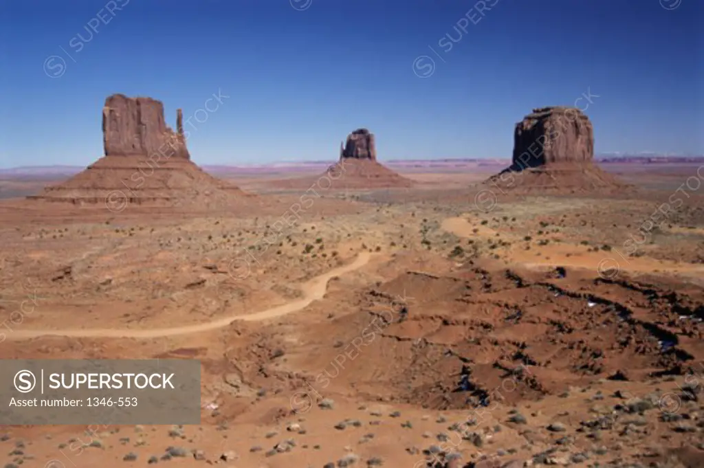 Rock formation on an arid landscape, Mittens Buttes, Monument Valley, Arizona, USA
