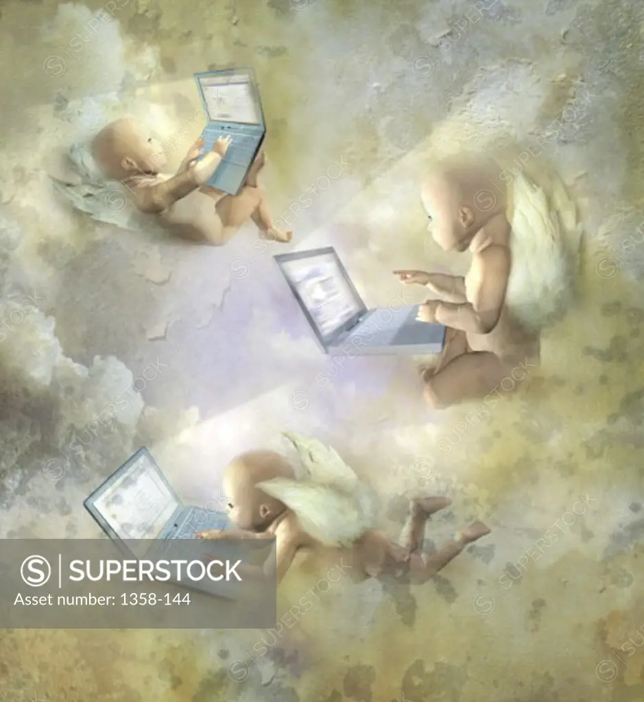 Three cherubs using laptops