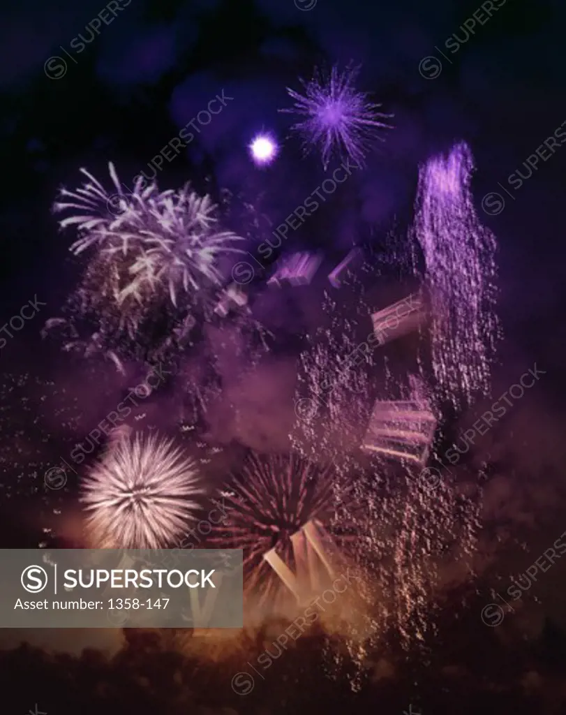 Fireworks display at night in a city