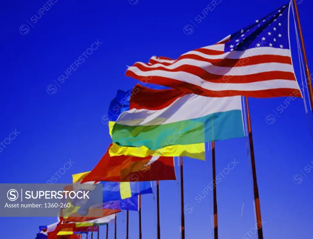 Low angle view of an array of flags of different countries
