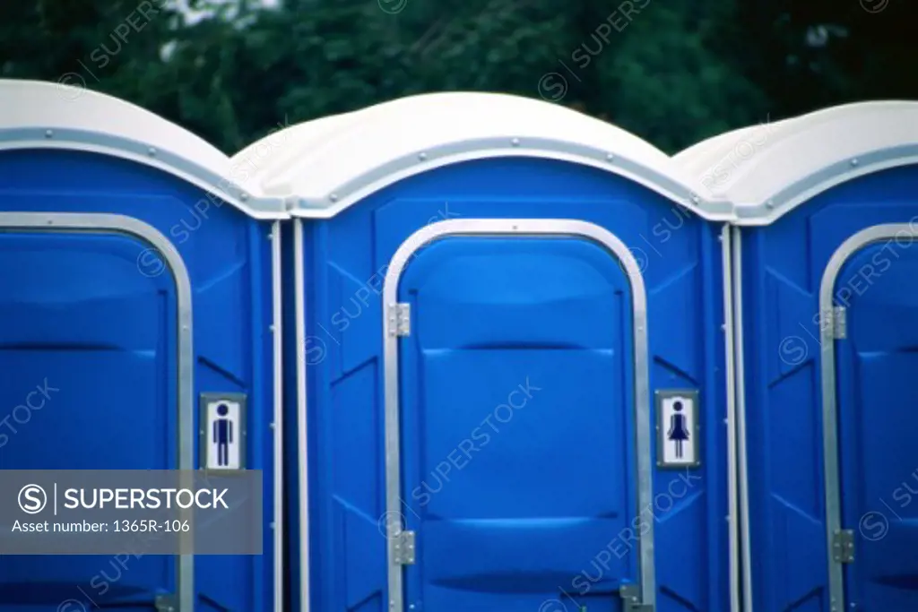 Close-up of an array of portable toilets