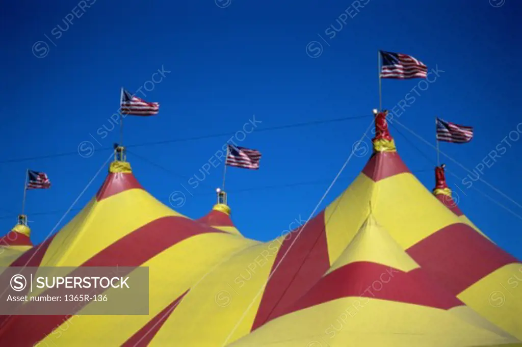 Low angle view of flag of the United States of American on top of a circus tent