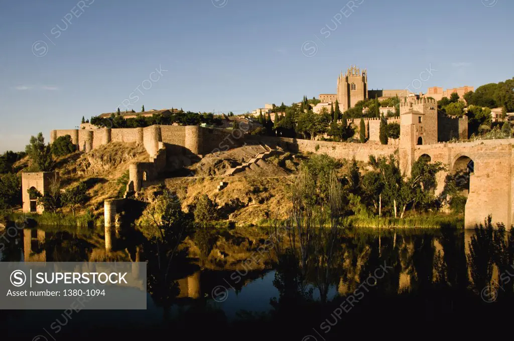 Medieval bridge across a river, Puente De San Martin, Toledo, Castilla La Mancha, Spain