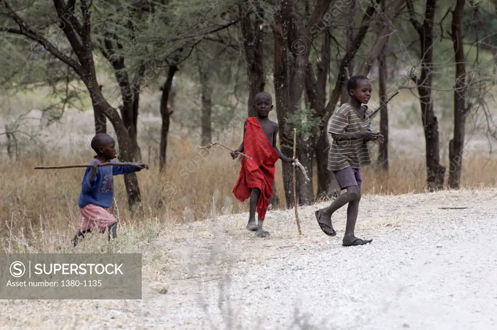 Masai children in a forest, Tarangire National Park, Arusha Region, Tanzania