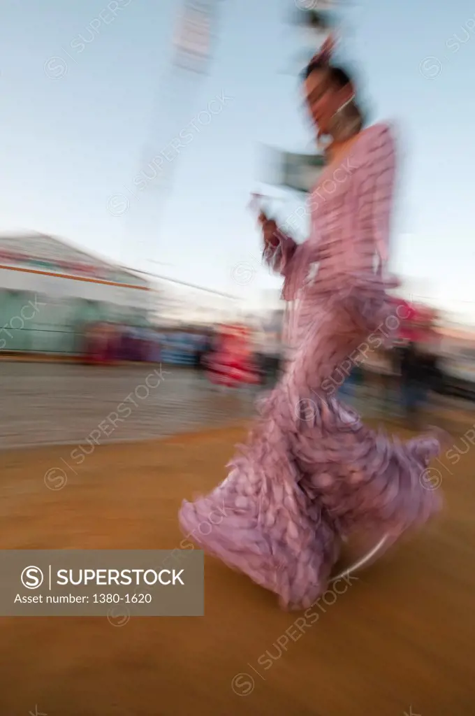 Woman in traditional flamenco dress during the Seville Fair, Seville, Andalusia, Spain