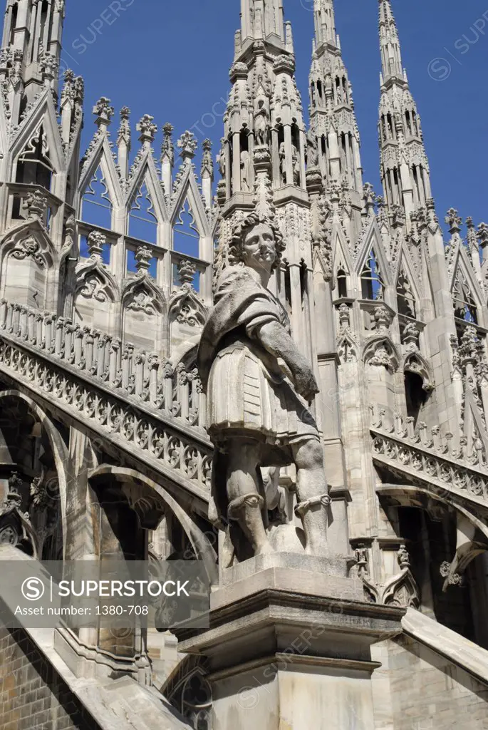 Statue in front of a church, Duomo, Milan, Lombardy, Italy