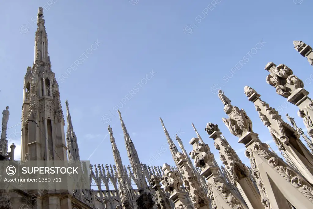 Low angle view of towers of a church, Duomo, Milan, Lombardy, Italy