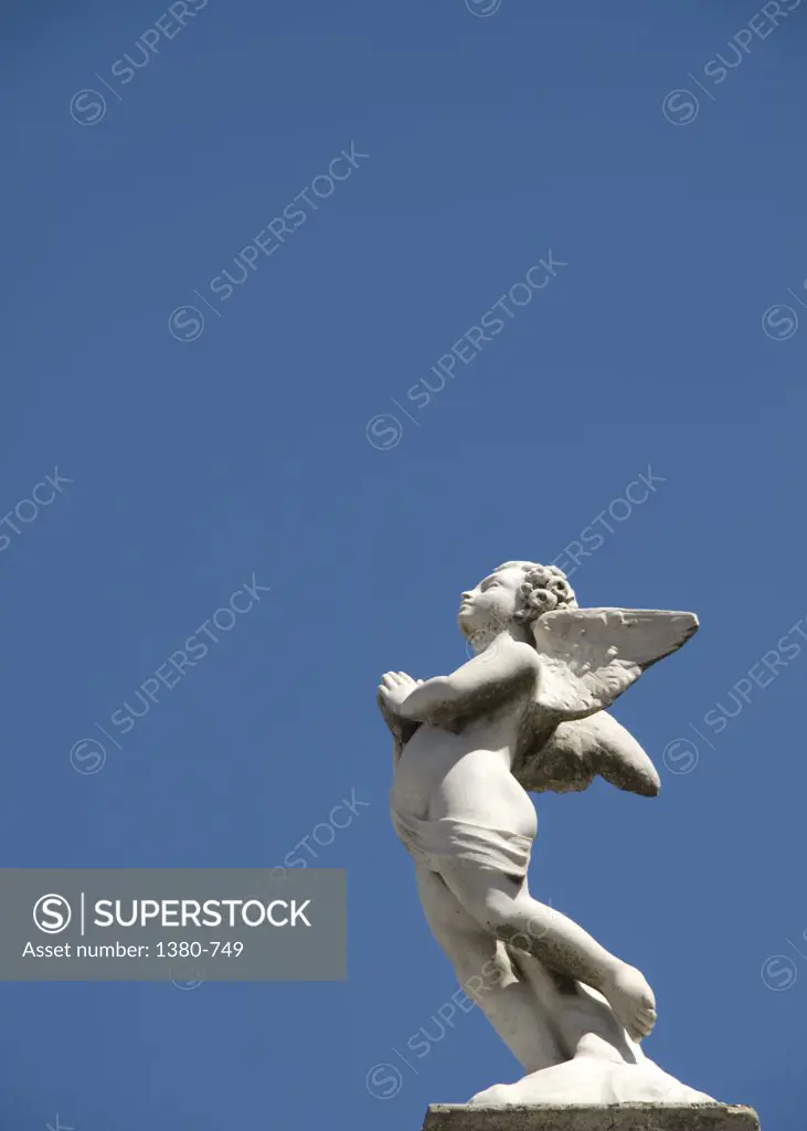Low angle view of a statue of an angel, Recoleta Cemetery, Buenos Aires, Argentina