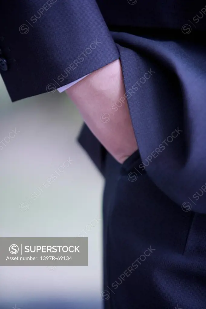 Close-up of man's hands in pockets