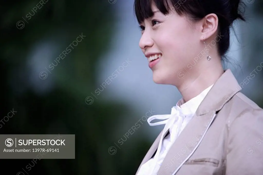 Young woman looking away and smiling