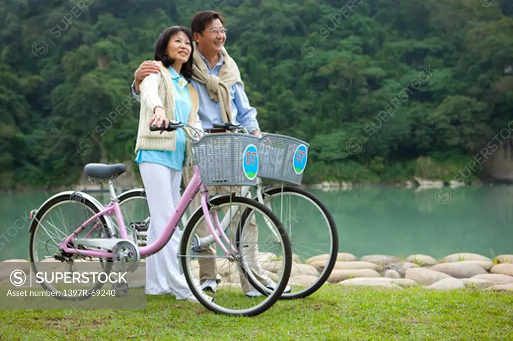 Couple, Couple holding bikes and bonding together with smile