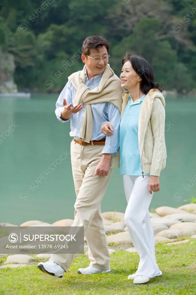 Couple, Couple walking and talking near the lake