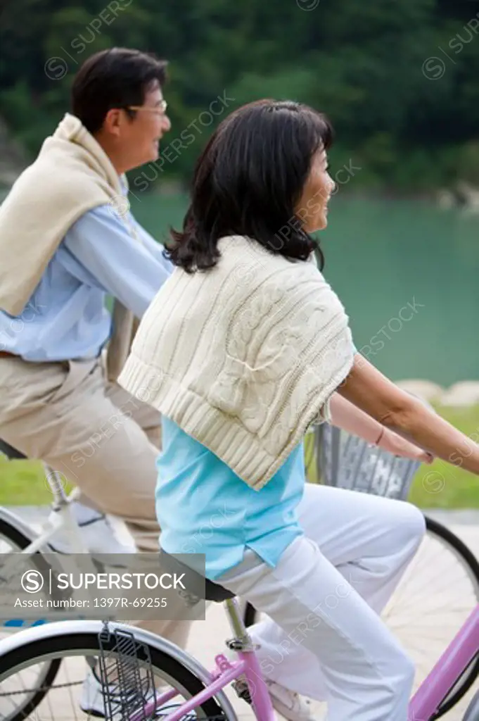Couple, Couple riding on bikes together