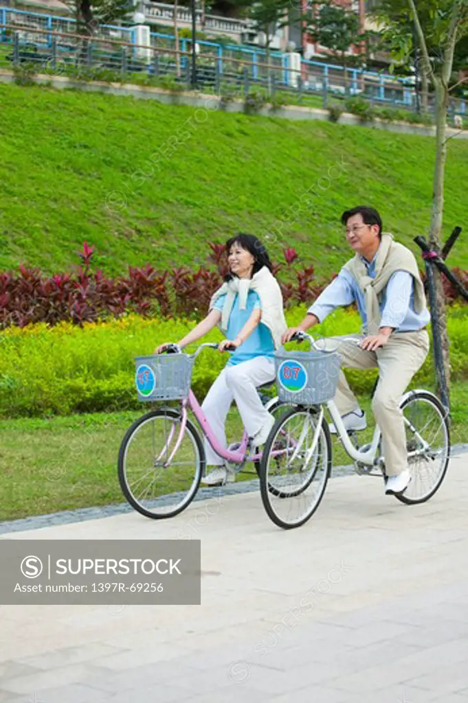 Couple, Couple riding on bikes together