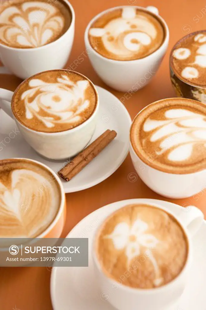 Coffee, Cups of cappuccino with different patterns on the table