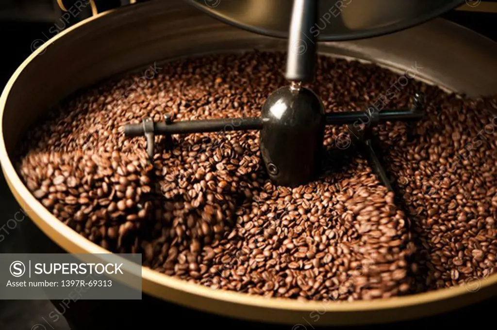 Close-up of coffee beans on the roasting machine