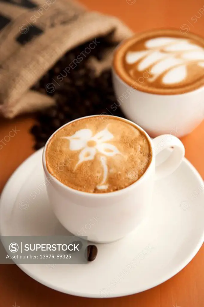 Coffee, Coffee Culture, Close-up of two cups of cappuccino with pattern on the table