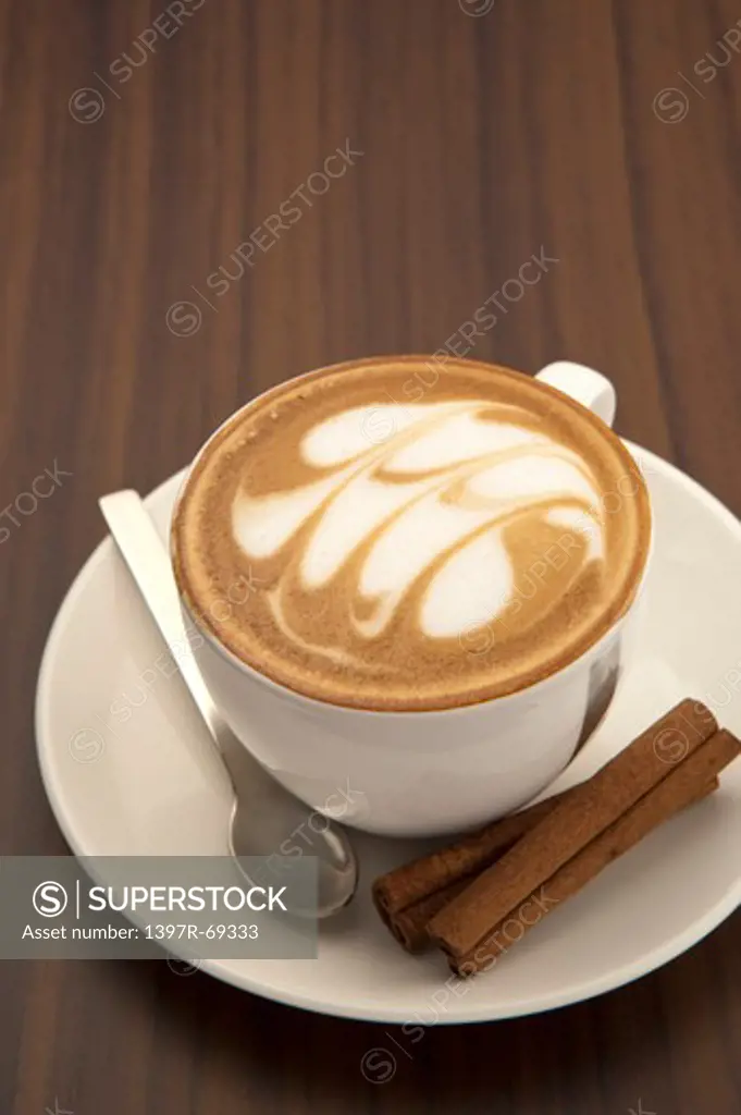 Coffee, Cappuccino, Close-up of a cup of cappuccino with pattern and dessert on the saucer