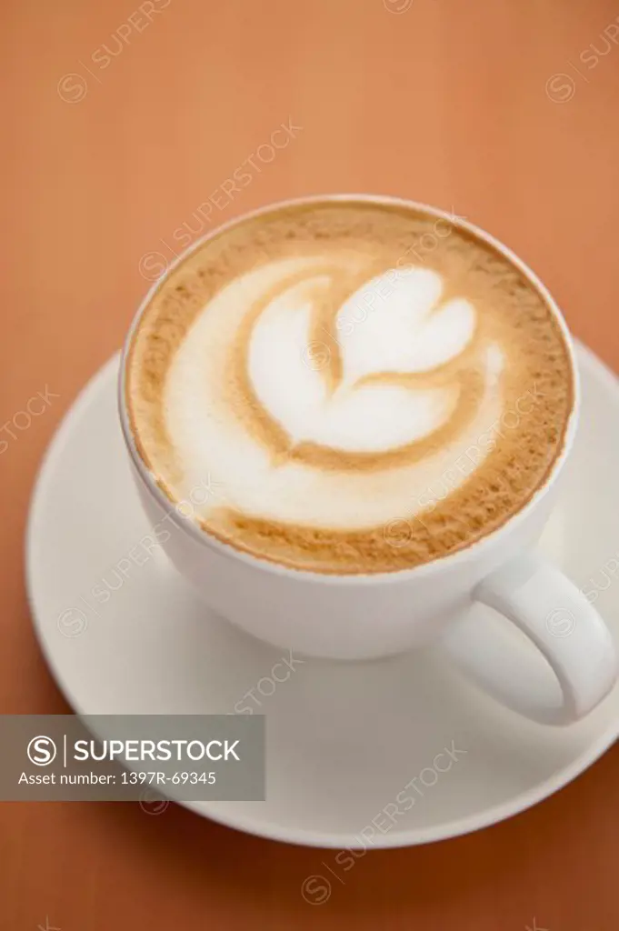 Coffee, Close-up of a cup of cappuccino with pattern on the table