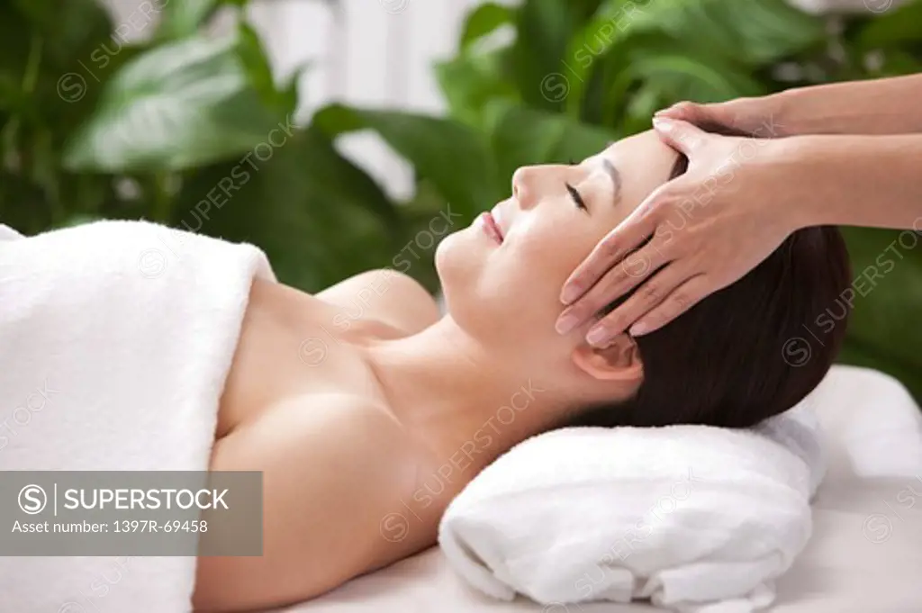 Beauty Treatment, Woman lying and enjoying massaging