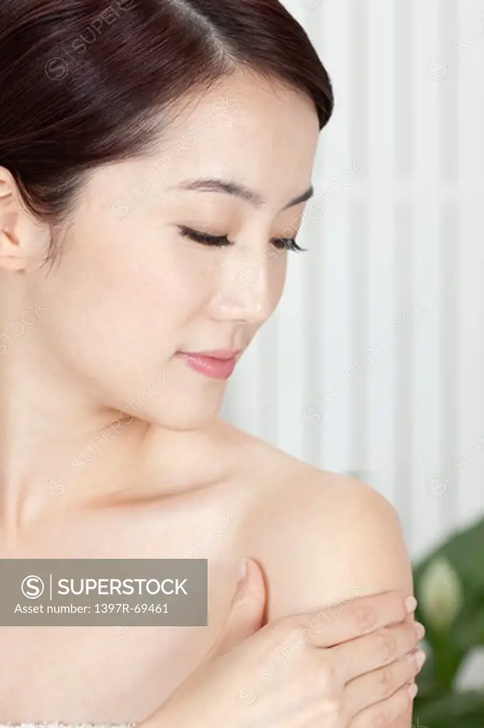 Beauty Treatment, Woman looking down with hand on shoulder