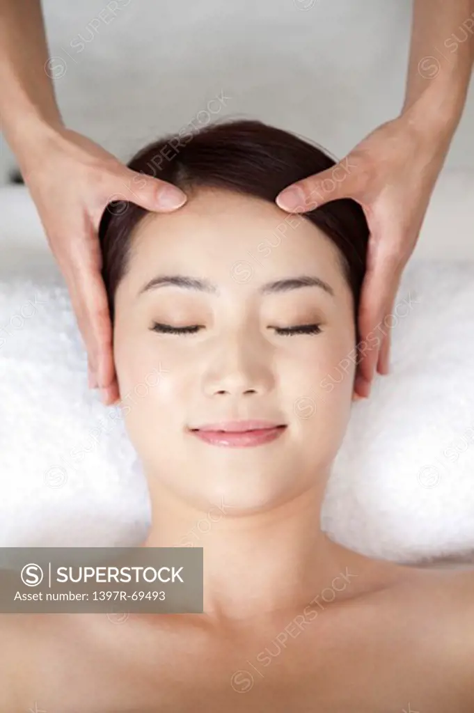 Beauty Treatment, Woman lying with eyes closed and enjoying massaging